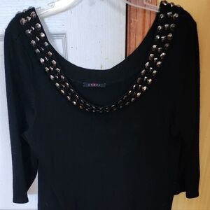 Cyrus off should black woman sweater with beading around the neck line Size XL